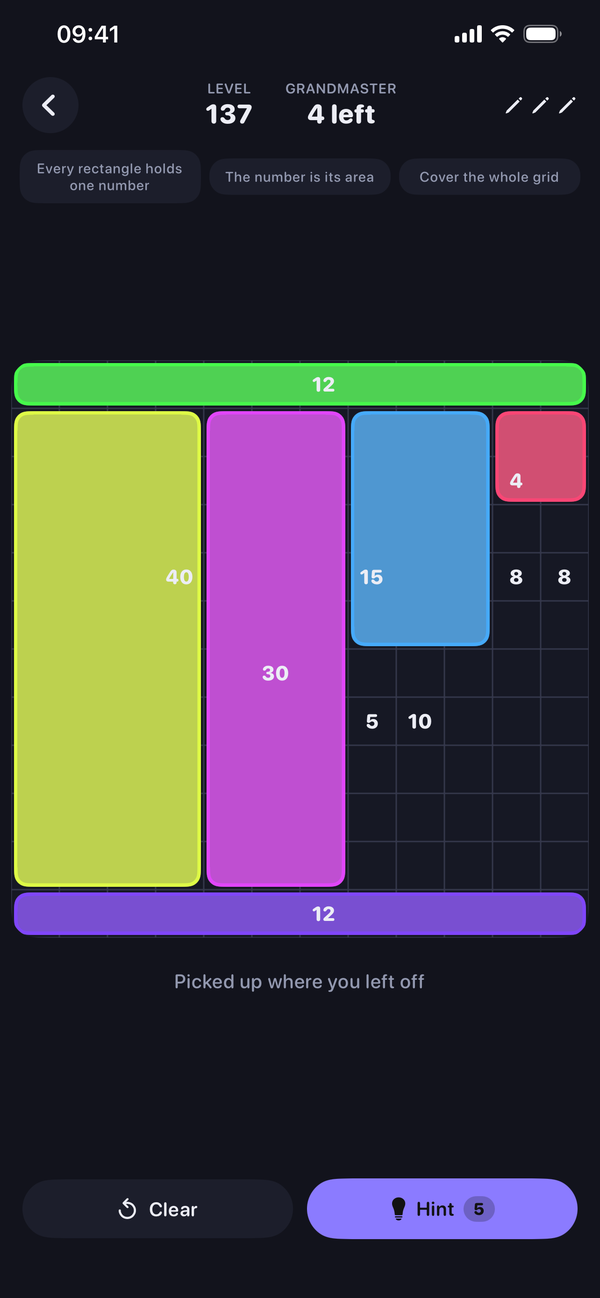 A Shikaku board part-solved in the Midnight theme, with numbered clues and drawn rectangles.